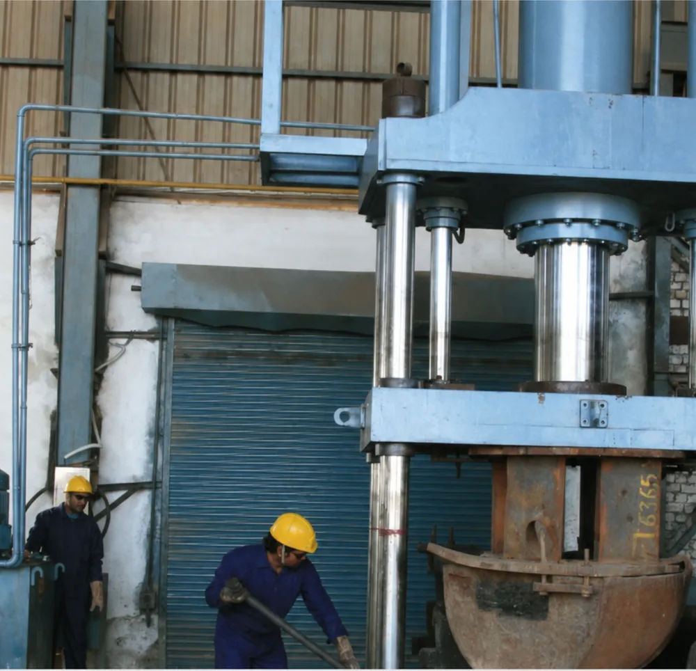 Hydraulic press forming — P.K. Tubes & Fittings manufacturing facility.