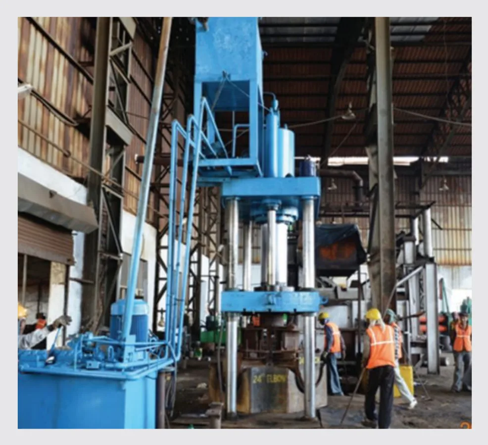 Heavy hydraulic press — P.K. Tubes & Fittings manufacturing facility.
